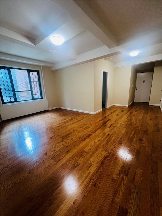 1722 Purdy St Unit 1H, Bronx, NY 10462 - spare room featuring wood finished floors and beamed ceiling