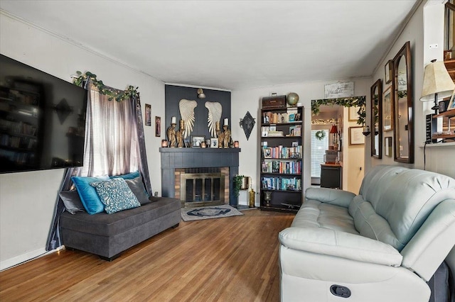 209 Venetian Blvd, Lindenhurst, NY 11757 - living room featuring wood finished floors and a fireplace