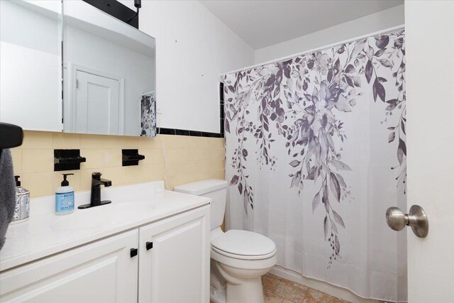 209 Venetian Blvd, Lindenhurst, NY 11757 - full bathroom with vanity, tile walls, and curtained shower