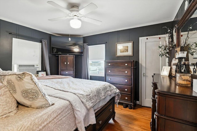 209 Venetian Blvd, Lindenhurst, NY 11757 - bedroom featuring light wood-type flooring, cooling unit, crown molding, ceiling fan, and a decorative wall