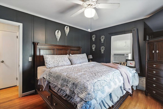 209 Venetian Blvd, Lindenhurst, NY 11757 - bedroom featuring wood finished floors, ornamental molding, cooling unit, and a ceiling fan