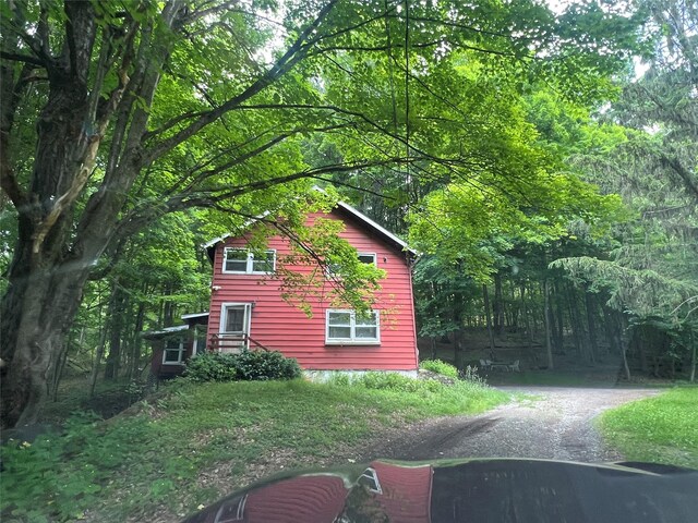 1391 County Route 7, Ancram, NY 12502 - view of side of home featuring dirt driveway