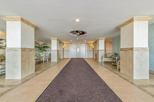 1 E Broadway Unit 5K, Long Beach, NY 11561 - building lobby with recessed lighting and tile walls