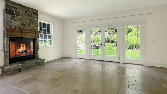 33 Victoria Dr, Cold Spring, NY 10516 - unfurnished living room with stone tile flooring, a fireplace, and recessed lighting