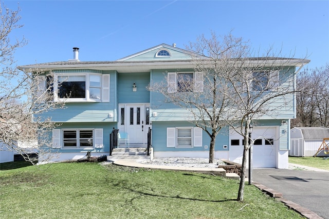 15 Castle Ct, Thiells, NY 10984 - raised ranch with a front yard, an attached garage, driveway, and entry steps