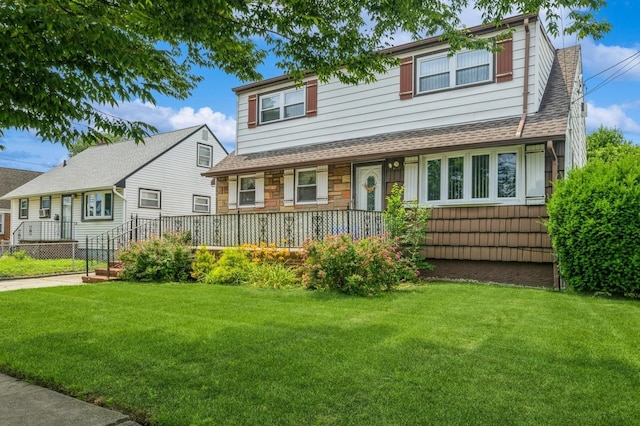 66 Gates Ave, Valley Stream, NY 11580 - view of front of home with a front lawn and a shingled roof