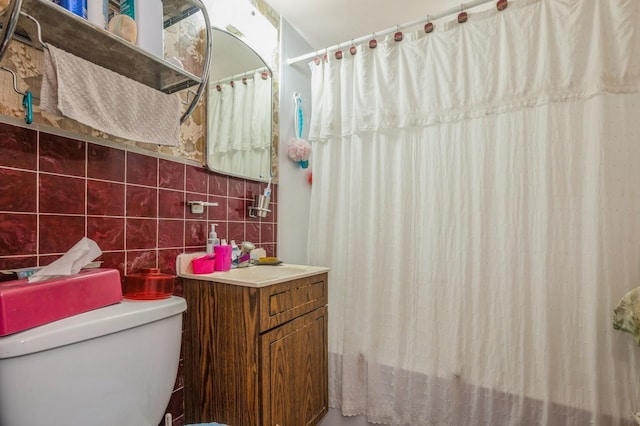 66 Gates Ave, Valley Stream, NY 11580 - bathroom with vanity, tile walls, and a shower with shower curtain