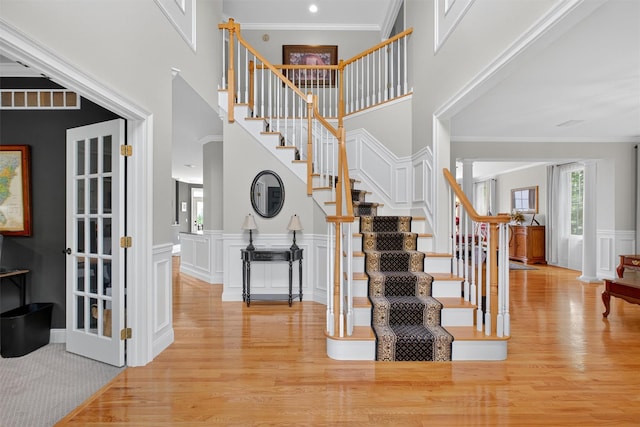 36 Ballymeade Rd, Hopewell Junction, NY 12533 - stairs with wood finished floors, ornate columns, crown molding, wainscoting, and a decorative wall