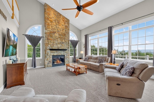 36 Ballymeade Rd, Hopewell Junction, NY 12533 - carpeted living area with healthy amount of natural light, high vaulted ceiling, ceiling fan, and a stone fireplace