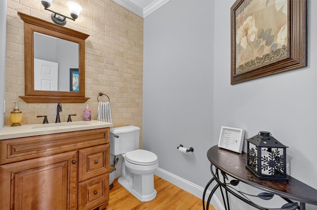 36 Ballymeade Rd, Hopewell Junction, NY 12533 - half bathroom with ornamental molding, wood finished floors, vanity, and decorative backsplash