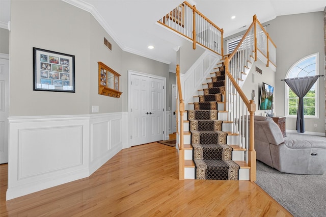 36 Ballymeade Rd, Hopewell Junction, NY 12533 - stairs with wood finished floors, crown molding, recessed lighting, and wainscoting