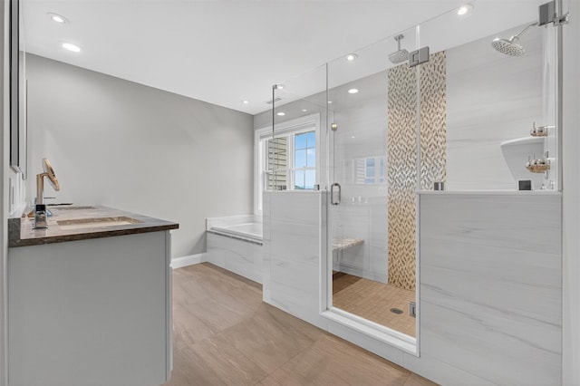 36 Ballymeade Rd, Hopewell Junction, NY 12533 - full bath featuring a garden tub, a shower stall, vanity, and recessed lighting