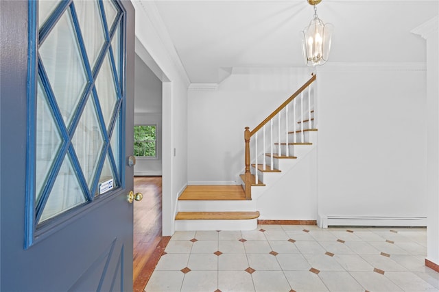 21 Kipp St, Chappaqua, NY 10514 - tiled entrance foyer featuring baseboard heating, stairs, a chandelier, and crown molding