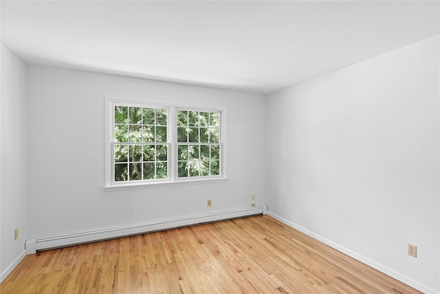 21 Kipp St, Chappaqua, NY 10514 - unfurnished room with a baseboard heating unit and light wood finished floors