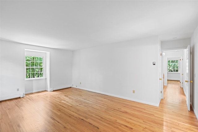 21 Kipp St, Chappaqua, NY 10514 - unfurnished room with light wood finished floors, a baseboard radiator, and healthy amount of natural light