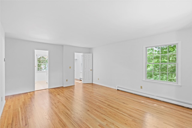 21 Kipp St, Chappaqua, NY 10514 - unfurnished room featuring baseboard heating and light wood-style floors