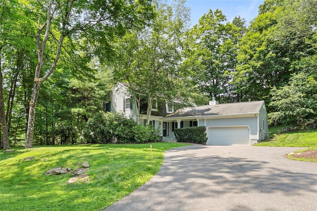 21 Kipp St, Chappaqua, NY 10514 - view of front of house with driveway, an attached garage, a front yard, and a chimney