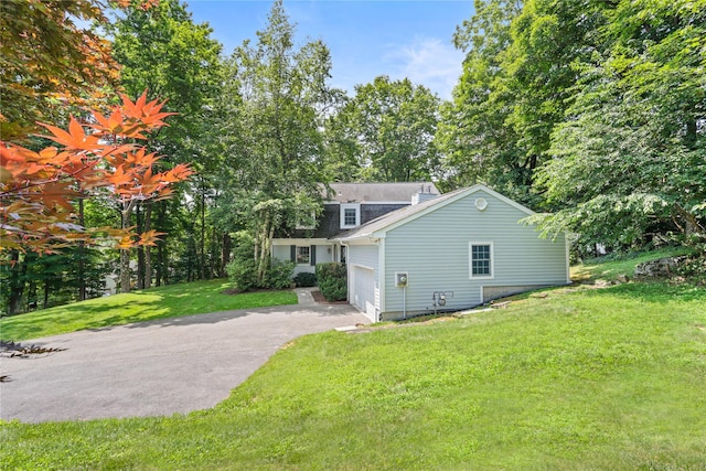 21 Kipp St, Chappaqua, NY 10514 - view of property exterior with asphalt driveway and a lawn