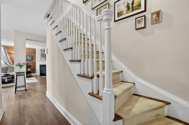 20 N Broadway Unit O-373, White Plains, NY 10601 - staircase featuring wood finished floors and a fireplace
