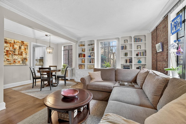 20 N Broadway Unit O-373, White Plains, NY 10601 - living area with ornamental molding, wood finished floors, built in features, and a chandelier