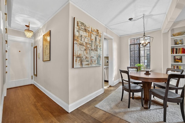 20 N Broadway Unit O-373, White Plains, NY 10601 - dining space with a chandelier, ornamental molding, and wood finished floors