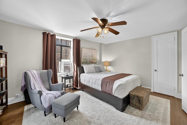 20 N Broadway Unit O-373, White Plains, NY 10601 - bedroom with wood finished floors, ceiling fan, and cooling unit