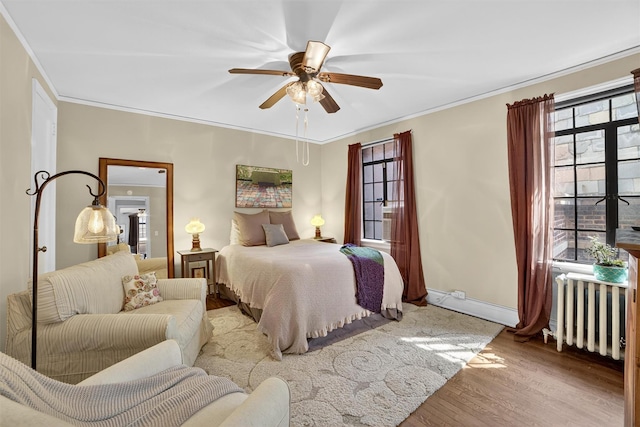 20 N Broadway Unit O-373, White Plains, NY 10601 - bedroom featuring radiator, wood finished floors, a ceiling fan, and ornamental molding