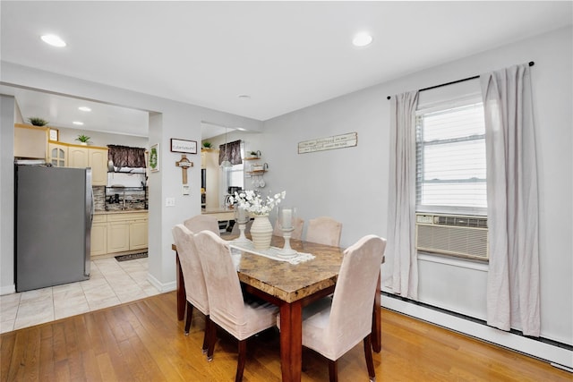 12311 115th Ave, South Ozone Park, NY 11420 - dining space featuring a baseboard radiator, light wood-style flooring, and recessed lighting