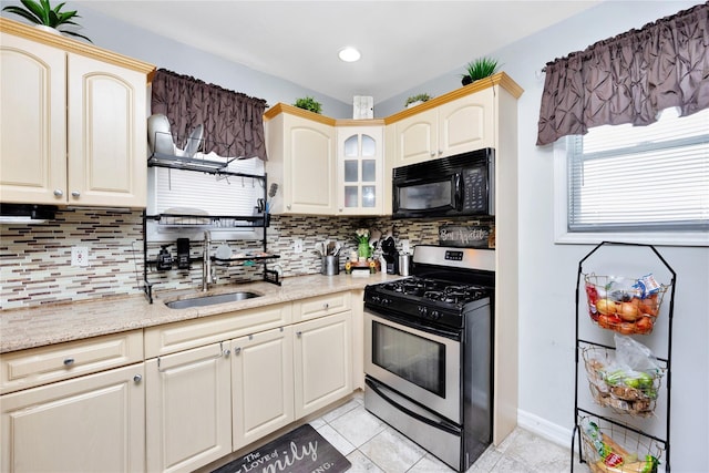12311 115th Ave, South Ozone Park, NY 11420 - kitchen featuring black microwave, gas stove, backsplash, light tile patterned flooring, and recessed lighting