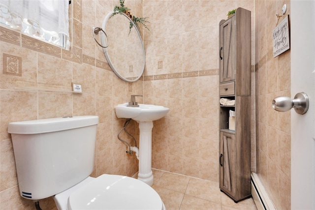 12311 115th Ave, South Ozone Park, NY 11420 - half bathroom featuring tile walls, baseboard heating, and tile patterned flooring