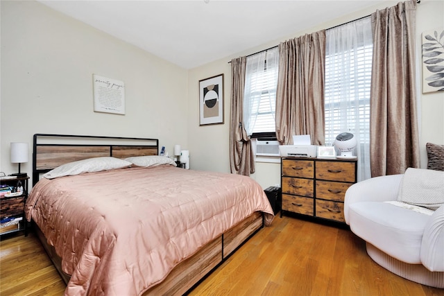 12311 115th Ave, South Ozone Park, NY 11420 - bedroom featuring wood finished floors and cooling unit