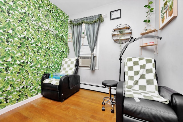 12311 115th Ave, South Ozone Park, NY 11420 - sitting room with a baseboard radiator and wood finished floors