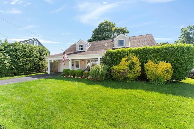 2691 Evans Rd, Oceanside, NY 11572 - cape cod home with a front lawn, asphalt driveway, and a carport