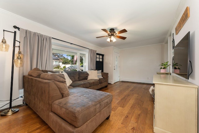 2691 Evans Rd, Oceanside, NY 11572 - living area featuring a ceiling fan, wood finished floors, a baseboard radiator, and crown molding