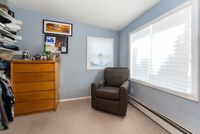 2691 Evans Rd, Oceanside, NY 11572 - sitting room featuring a baseboard radiator, vaulted ceiling, and carpet