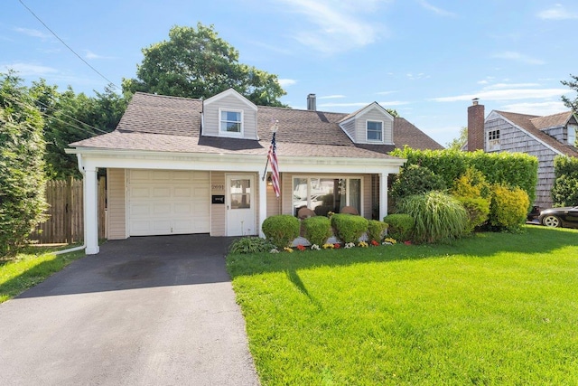 2691 Evans Rd, Oceanside, NY 11572 - cape cod house featuring an attached garage and asphalt driveway