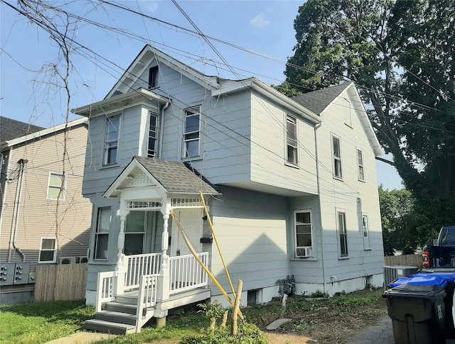 34 High St, Poughkeepsie, NY 12601 - view of front of house with a shingled roof and cooling unit