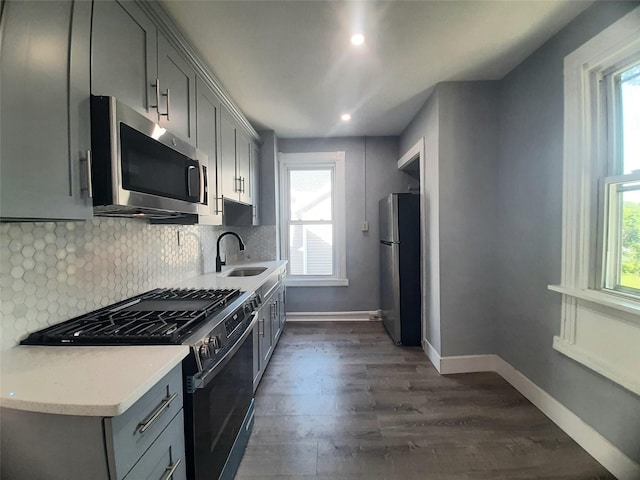 34 High St, Poughkeepsie, NY 12601 - kitchen featuring appliances with stainless steel finishes, gray cabinets, plenty of natural light, and recessed lighting