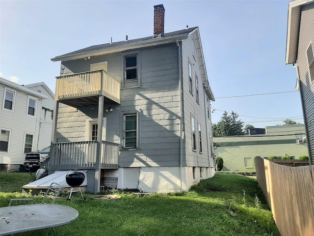 34 High St, Poughkeepsie, NY 12601 - back of house with a balcony and a chimney
