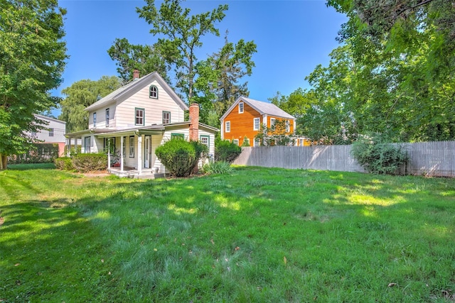 2 Shore Rd, East Setauket, NY 11733 - rear view of house featuring a porch and a chimney