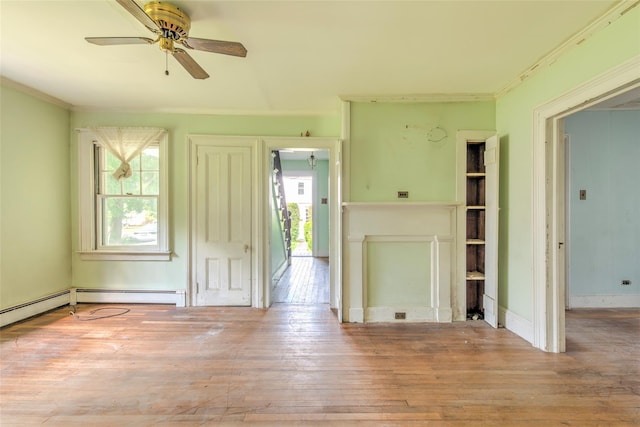 2 Shore Rd, East Setauket, NY 11733 - unfurnished living room featuring ornamental molding, hardwood / wood-style floors, and ceiling fan