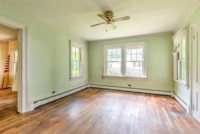 2 Shore Rd, East Setauket, NY 11733 - empty room with baseboard heating, wood-type flooring, ceiling fan, and crown molding