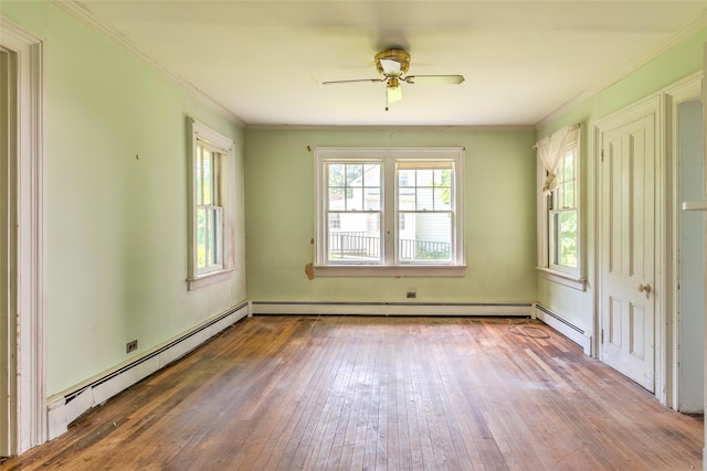 2 Shore Rd, East Setauket, NY 11733 - unfurnished room with hardwood / wood-style flooring, baseboard heating, ceiling fan, and crown molding