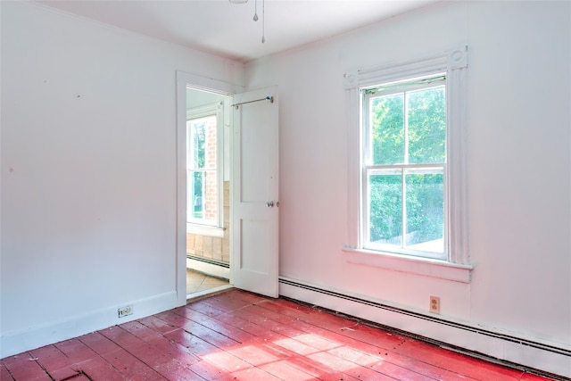 2 Shore Rd, East Setauket, NY 11733 - unfurnished room with a baseboard heating unit, plenty of natural light, crown molding, and light wood-type flooring