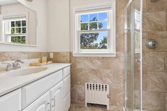 8 Walnut Rd, East Rockaway, NY 11518 - full bath featuring radiator heating unit, vanity, a shower stall, and healthy amount of natural light