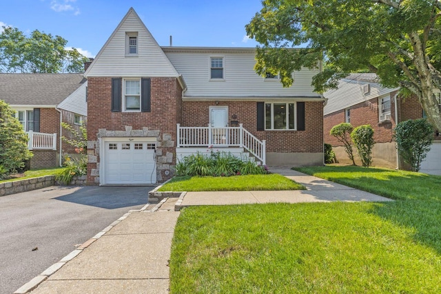 8 Walnut Rd, East Rockaway, NY 11518 - view of front facade featuring driveway, brick siding, a garage, and a front yard