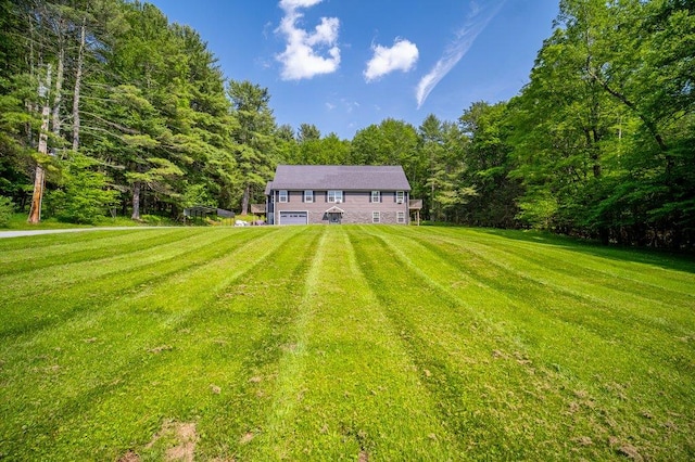 55 Townsend Rd, Liberty, NY 12754 - rear view of house with a yard, a garage, and a forest view