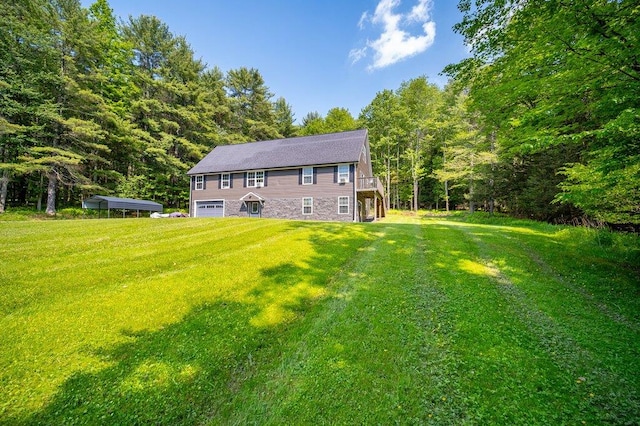 55 Townsend Rd, Liberty, NY 12754 - back of house with a garage, a yard, and a forest view