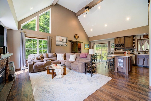 55 Townsend Rd, Liberty, NY 12754 - living area featuring high vaulted ceiling, dark wood-style flooring, beamed ceiling, a ceiling fan, and a stone fireplace