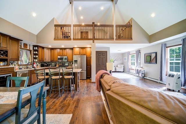 55 Townsend Rd, Liberty, NY 12754 - living area featuring high vaulted ceiling, dark wood-style floors, plenty of natural light, and recessed lighting